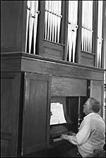 Alan Langton playing the organ at Stoke Dry church. 